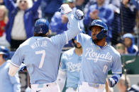 Kansas City Royals' Bobby Witt Jr. (7) celebrates hitting a two-run home run with Maikel Garcia (11) during the first inning of a baseball game against the Houston Astros in Kansas City, Mo., Thursday, April 11, 2024. (AP Photo/Colin E. Braley)
