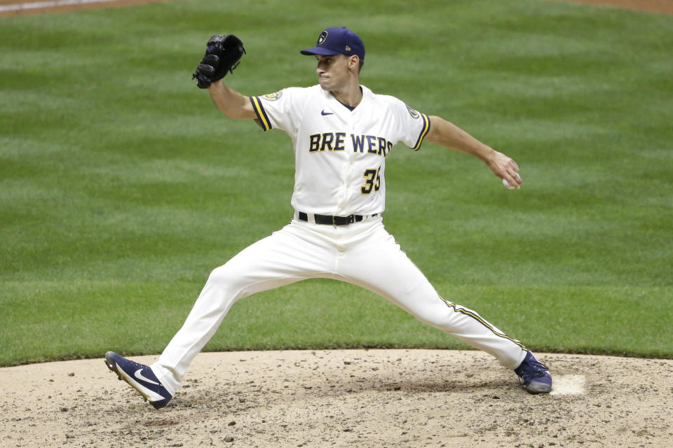 Milwaukee Brewers' Brent Suter pitches during the seventh inning of a baseball game against the Cincinnati Reds Tuesday, Aug. 25, 2020, in Milwaukee. (AP Photo/Aaron Gash)