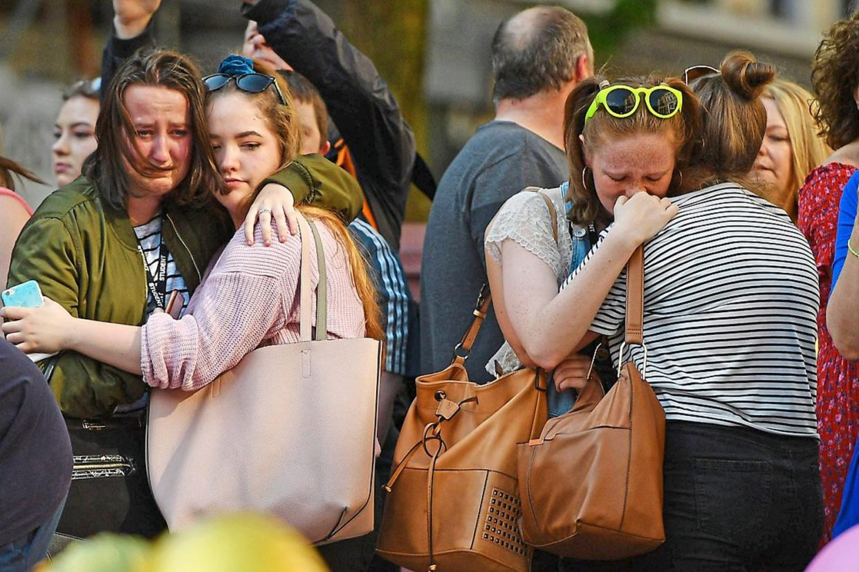 Terror zone: grief-stricken crowds gathered in St Ann’s Square, Manchester, after the suicide bombing which took 22 young lives last May: BRUCE ADAMS/DAILY MAIL