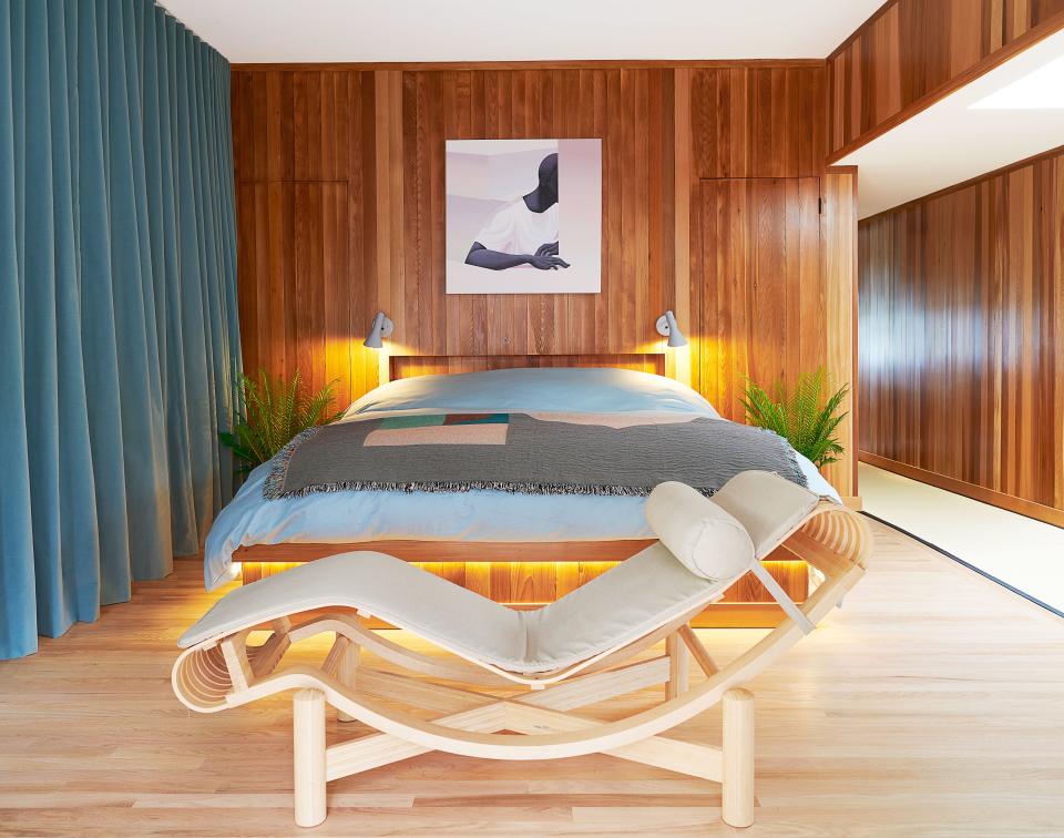 A Charlotte Perriand chaise longue anchors the master bedroom.