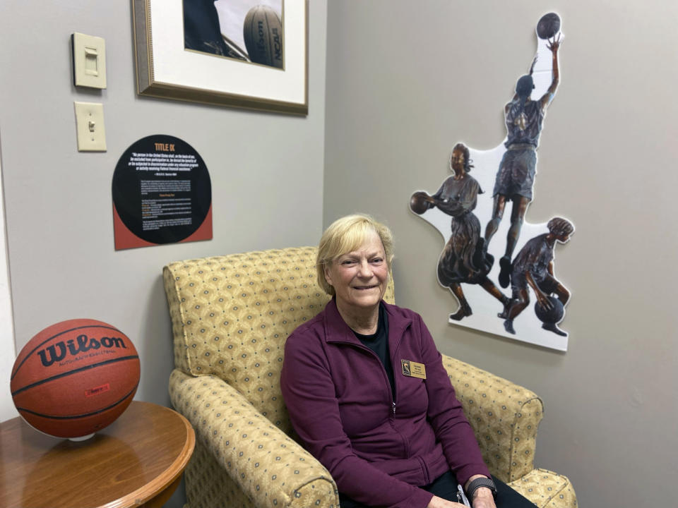 Debbie Ryan poses at the Women's Basketball Hall of Fame in Knoxville, Tenn., Saturday, June 11, 2022. Marsha Sharp, Ann Meyers Drysdale, Debbie Ryan and others all worked their way through the nascent days of Title IX to the heights of women’s basketball. (AP Photo/Teresa Walker)