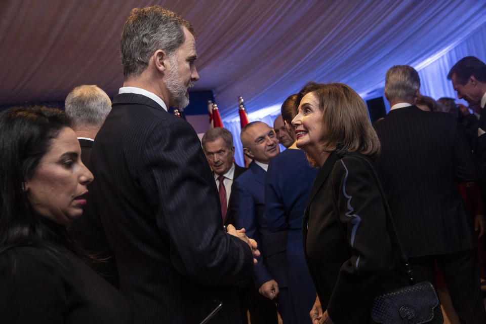 Spain's King Felipe VI speaks with U.S. Speaker of the House Nancy Pelosi in Jerusalem on Wednesday, Jan. 22, 2020. Dozens of world leaders have descended upon Jerusalem for the largest-ever gathering focused on commemorating the Holocaust and combating modern-day anti-Semitism. (Heidi Levine/Pool photo via AP)