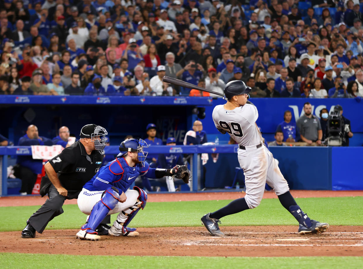 New York Yankees' Aaron Judge hits his 61st home run of the season against the Toronto Blue Jays on September 28, 2022 in Toronto, Ontario, Canada. (Photo by Vaughn Ridley/Getty Images)