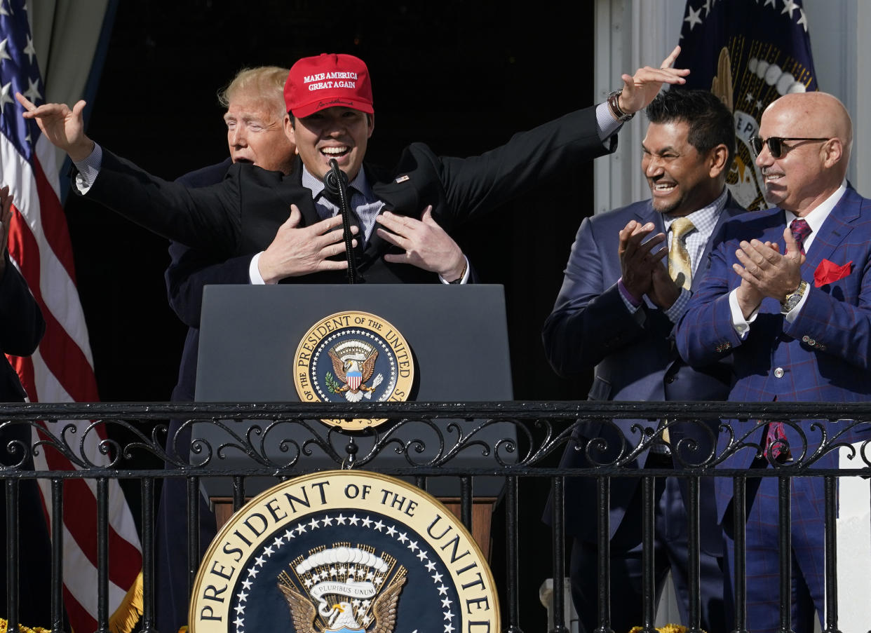 Nationals catcher Kurt Suzuki shares an awkward hug with Donald Trump during the team's celebratory visit to the White House. (Photo by Win McNamee/Getty Images)