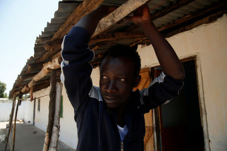 Mafu Hydara, a Gambian migrant who voluntarily returned from Libya, looks on as he stands at his home in Brikama, Gambia April 6, 2017. REUTERS/Luc Gnago