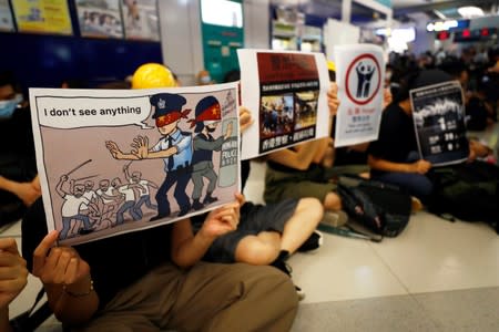 Protest at Yuen Long MTR station, the scene of an attack by suspected triad gang members a month ago