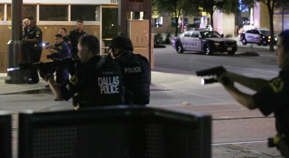 Police investigate a car shortly after the shooting during a protest in downtown Dallas. (Photo: LM Otero/AP)