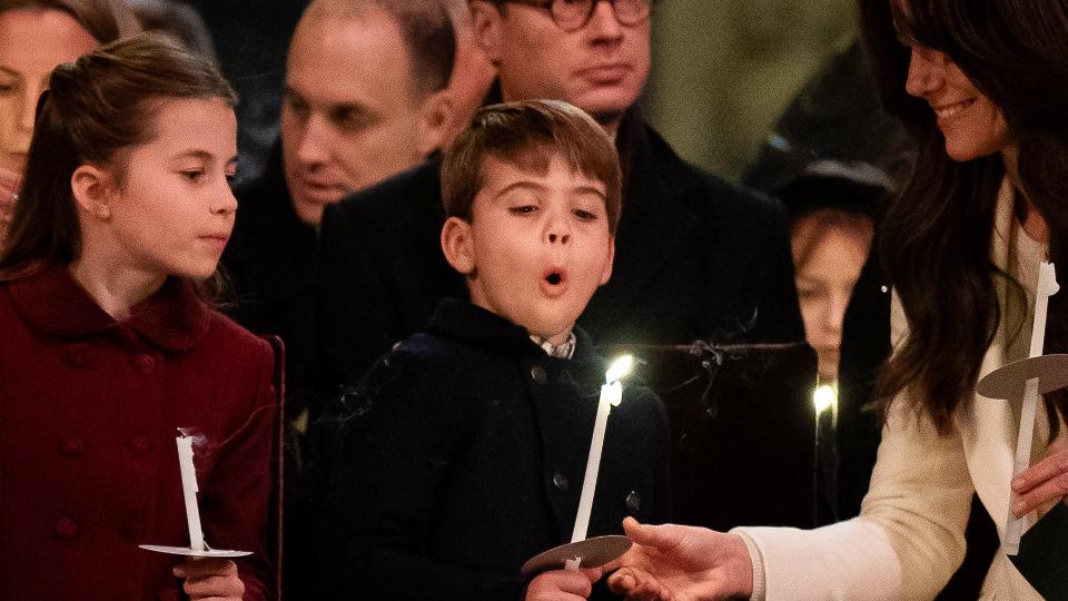 Prince Louis tries to blow out his candle