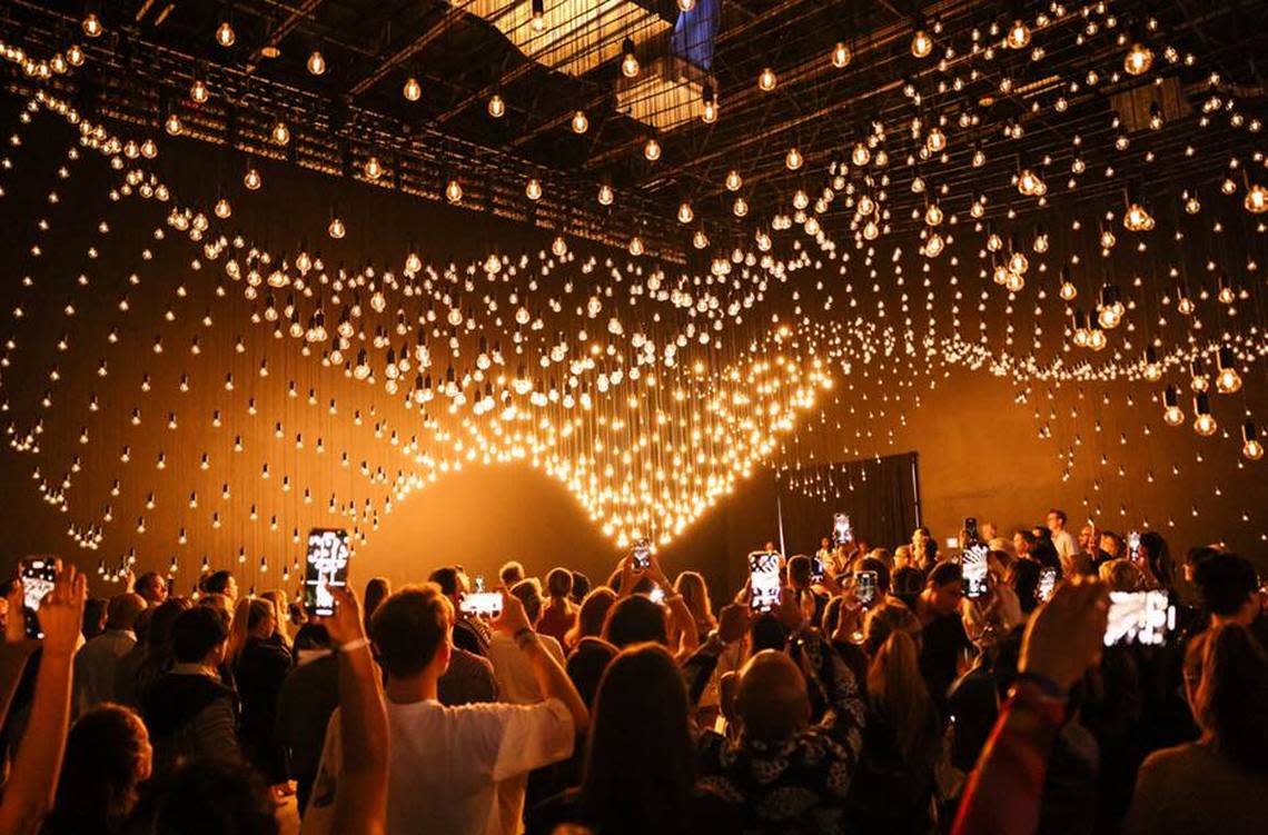 “Pulse Topology” by Rafael Lozano-Hemmer uses 3,000 light bulbs to capture the sound of visitors’ heartbeats.