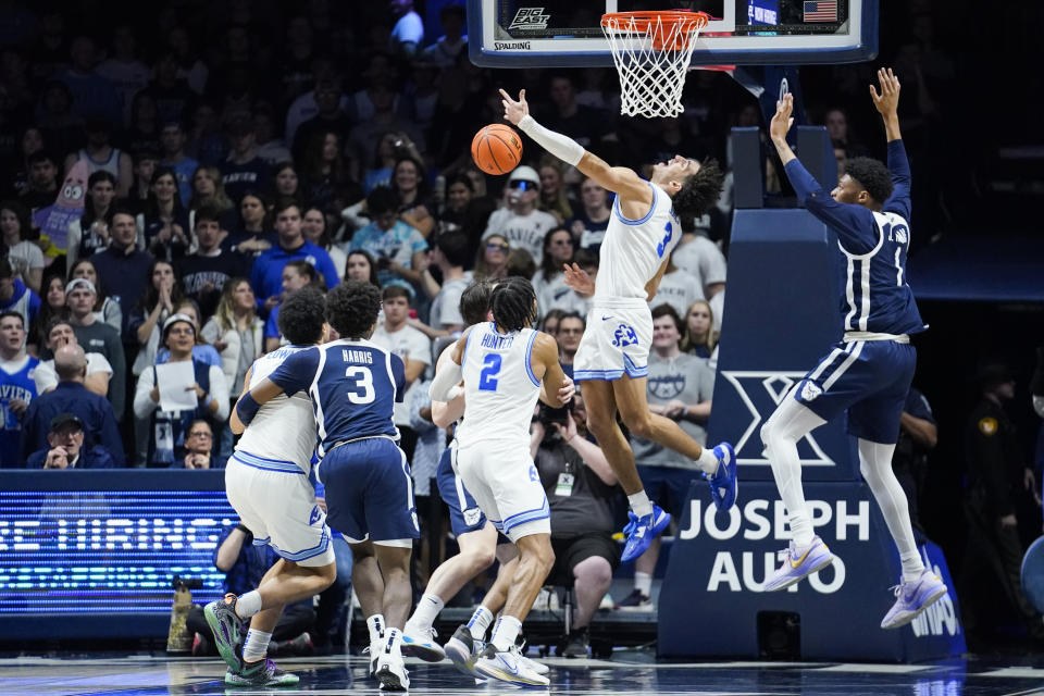 Xavier guard Colby Jones (3) misses a shot after he is fouled during the first half of an NCAA college basketball game against Butler, Saturday, March 4, 2023, in Cincinnati. (AP Photo/Joshua A. Bickel)