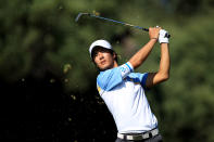 MELBOURNE, AUSTRALIA - NOVEMBER 18: Ryo Ishikawa of the International Team hits his second shot on the first hole during the Day Two Four-Ball Matches of the 2011 Presidents Cup at Royal Melbourne Golf Course on November 18, 2011 in Melbourne, Australia. (Photo by Scott Halleran/Getty Images)