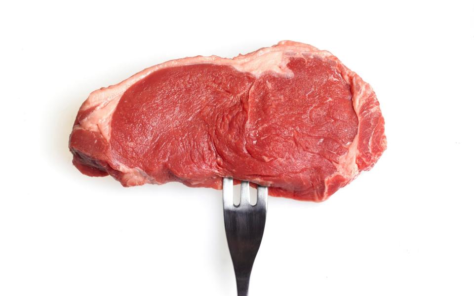 raw steak on a fork