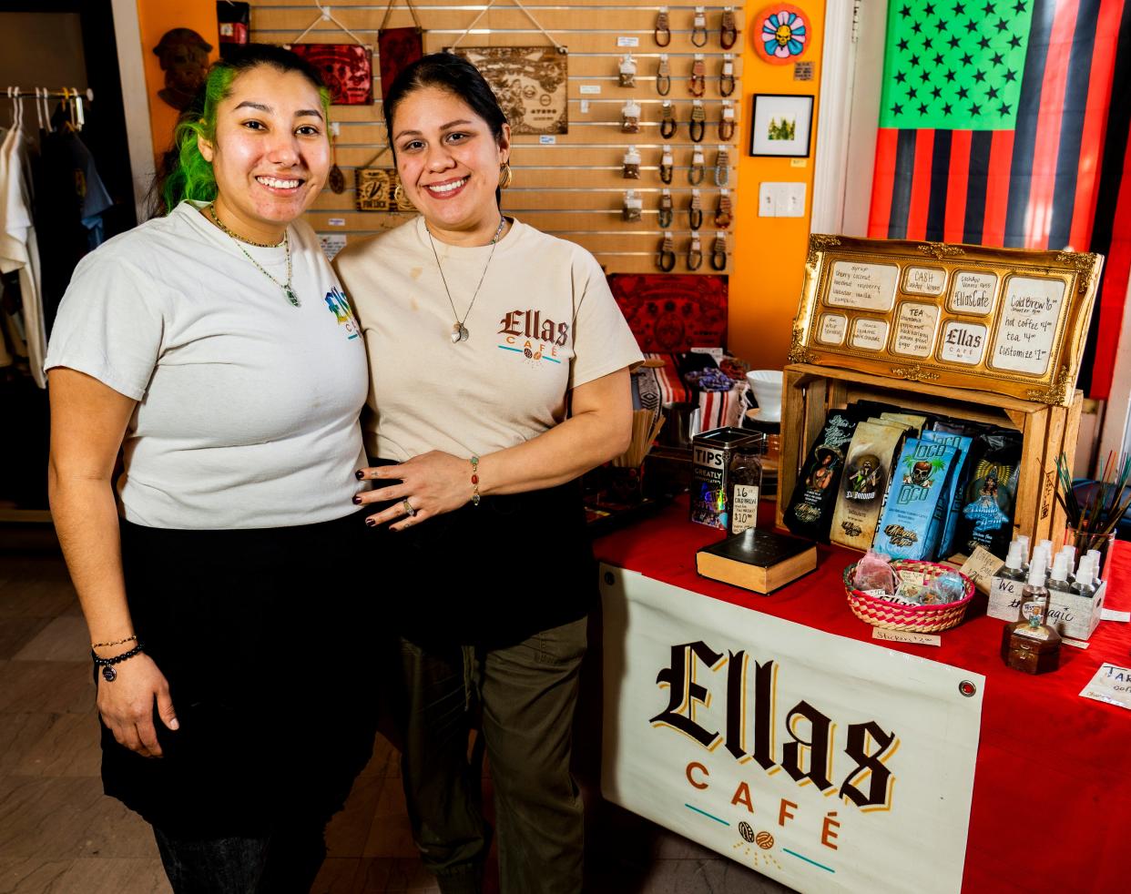 Reneé Valdez (left) and Sofía Fuentes (right), owners of Ellas Café, stand in front of their pop up coffee shop stand at Materia Magicka, a community based art and metaphysical supply shop on Sunday February 12, 2023 in Milwaukee, Wis.