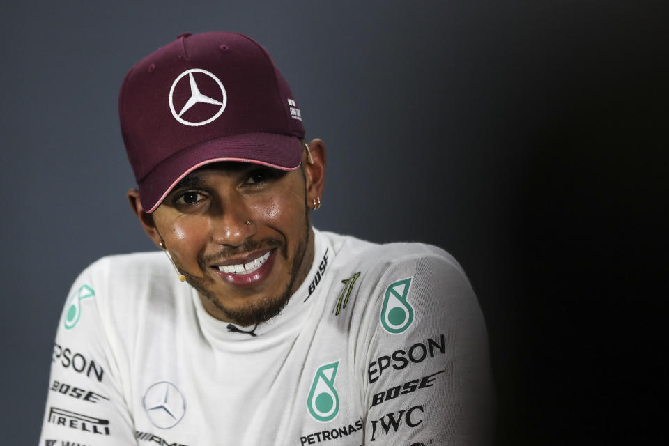 Mercedes driver Lewis Hamilton of Britain speaks at a press conference following his Singapore Formula One Grand Prix win at the Marina Bay City Circuit in Singapore, Sunday, Sept. 16, 2018. (AP Photo/Yong Teck Lim)