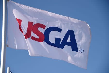 Jun 17, 2015; University Place, WA, USA; USGA flags on top of the first hole grandstand during practice rounds on Wednesday at Chambers Bay. Michael Madrid-USA TODAY Sports