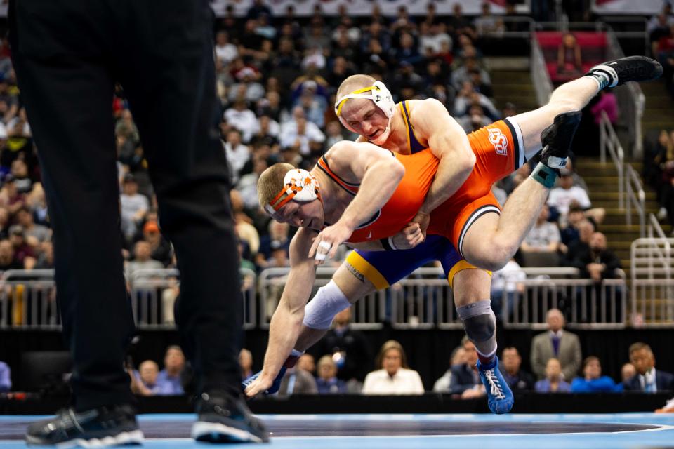 Northern Iowa's Parker Keckeisen, top, beat Oklahoma State's Dustin Plott in the 184-pound final Saturday at the NCAA Championships in Kansas City.