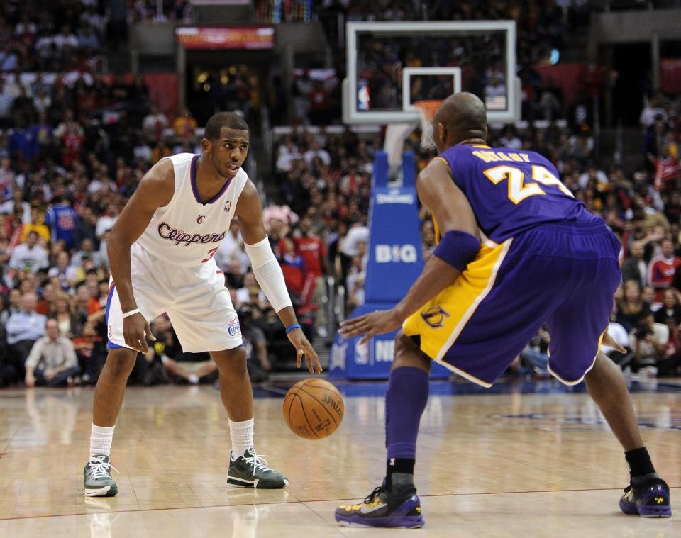 los angeles, ca april 04 chris paul 3 of the los angeles clippers dribbles as he is guarded by kobe bryant 24 of the los angeles lakers at staples center on april 4, 2012 in los angeles, california note to user user expressly acknowledges and agrees that, by downloading and or using this photograph, user is consenting to the terms and conditions of the getty images license agreement photo by harry howgetty images