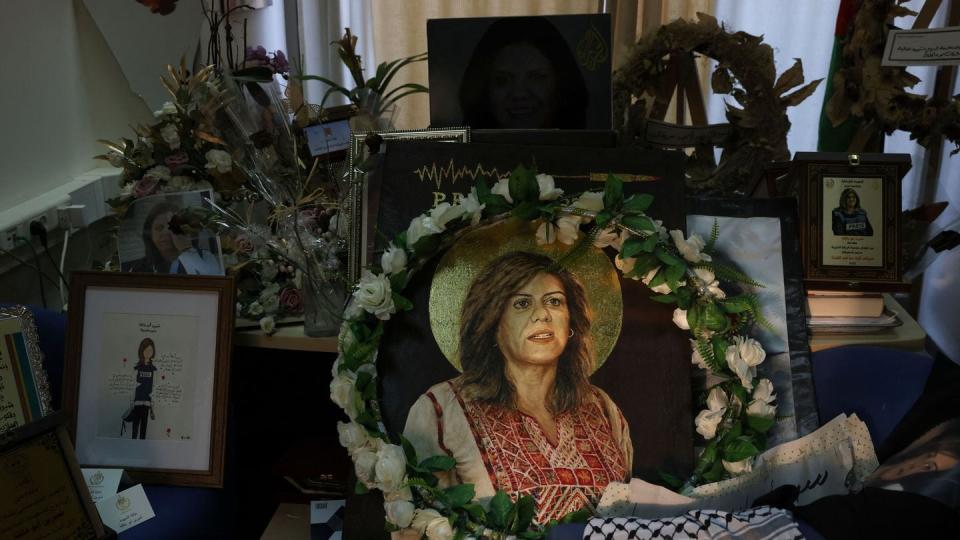 Pictures and objects are displayed in memory of slain journalist Shireen Abu Akleh in the room that used to be her office at the Al Jazeera news channel in the West Bank city of Ramallah on May 9, 2023. (Ahman Gharabli/AFP via Getty Images)