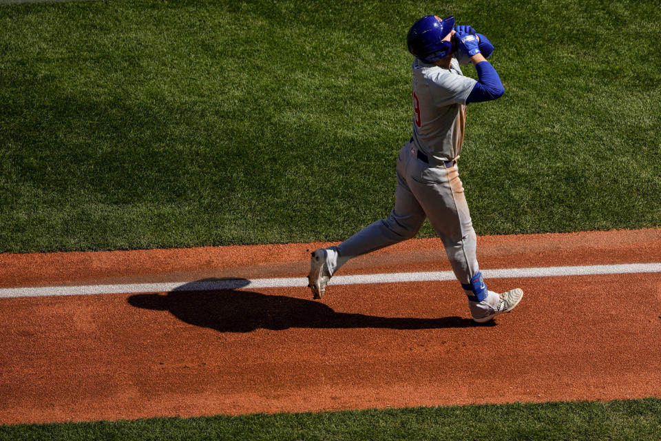 Chicago Cubs' Michael Busch jogs home after hitting a two-run home run against the Seattle Mariners during the fourth inning of a baseball game Sunday, April 14, 2024, in Seattle. (AP Photo/Lindsey Wasson)