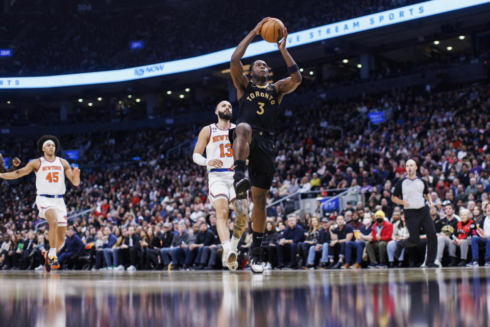 Toronto Raptors forward O.G. Anunoby (3) drives to the basket as New York Knicks guard Evan Fournier (13) trails during the first half of an NBA basketball game Friday, Jan. 6, 2023, in Toronto. (Cole Burston/The Canadian Press via AP)