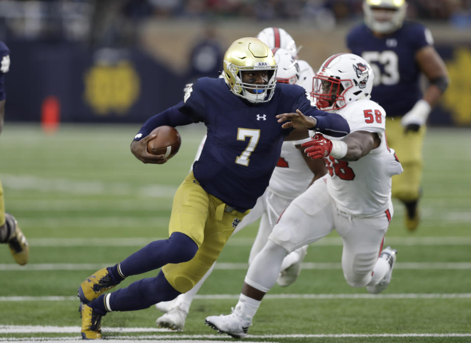 Notre Dame quarterback Brandon Wimbush is tackled by North Carolina State’s Airius Moore during the first half of an NCAA college football game, Saturday, Oct. 28, 2017, in South Bend, Ind. (AP Photo/Darron Cummings)