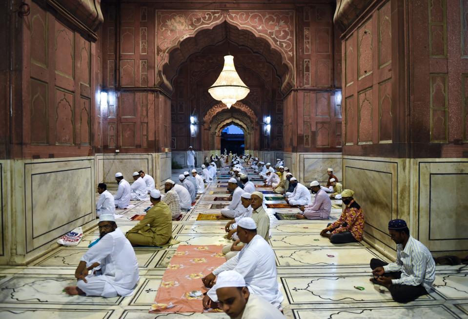 Muslim devotees wait to offer a special morning prayer to kick off the Eid al-Adha, the feast of sacrifice, at Jama Masjid mosque in New Delhi on August 1, 2020. (Photo by Money SHARMA / AFP) (Photo by MONEY SHARMA/AFP via Getty Images)
