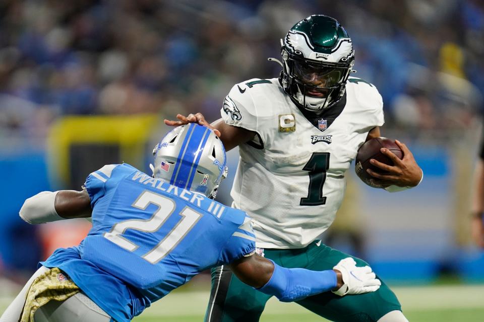 Eagles quarterback Jalen Hurts stiff arms Lions free safety Tracy Walker III during the second half of the Lions' 44-6 loss on Sunday, Oct. 31, 2021, at Ford Field.