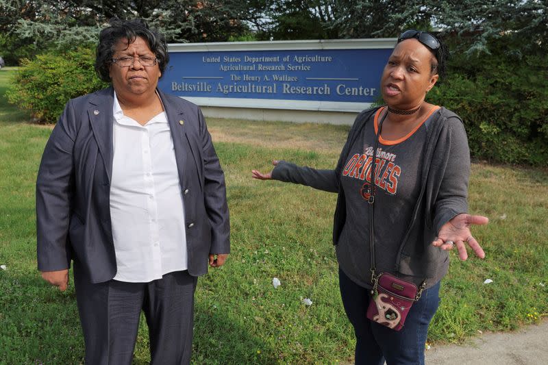 FILE PHOTO: Employees filing federal complaint alleging unsafe work conditions stand outside USDA’s Beltsville Agricultural Research Center in Maryland