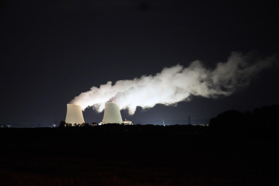 FILE - Steam escapes at night from the nuclear plant of Nogent-sur-Seine, 110 kms (63 miles) south east of Paris, Sunday, Aug. 8, 2021. Nuclear power is a central sticking point as negotiators plot out the world’s future energy strategy at the Glasgow climate talks. Critics decry its mammoth price tag, the accident risk and deadly waste. But a growing pro-nuclear camp argues that it’s safer on average than nearly any other energy source. (AP Photo/Francois Mori, File)