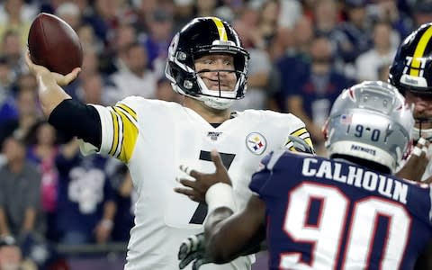 Pittsburgh Steelers quarterback Ben Roethlisberger passes under pressure from New England Patriots linebacker Shilique Calhoun (90) in the first half an NFL football game, Sunday, Sept. 8, 2019, in Foxborough - Credit: AP