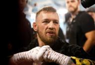 Conor McGregor of Ireland speaks with reporters before a workout at the UFC Performance Center in Las Vegas, Nevada, U.S., August 11, 2017. REUTERS/Steve Marcus