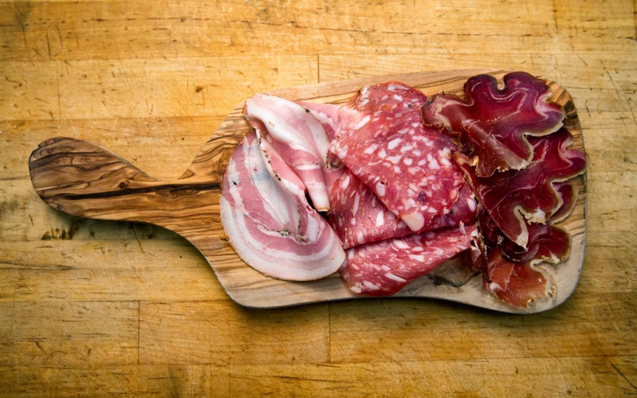Cold cuts of cured meat, ham or bacon, salami and prosciutto -  grandriver/Getty Images Contributor