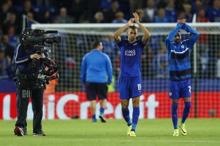 Britain Soccer Football - Leicester City v FC Porto - UEFA Champions League Group Stage - Group G - King Power Stadium, Leicester, England - 27/9/16 Leicester City's Islam Slimani and Riyad Mahrez applaud fans after the game Reuters / Eddie Keogh Livepic