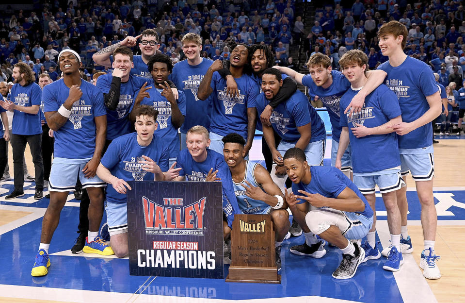 Members of the Indiana State men's basketball team pose with a Missouri Valley Conference men's basketball regular-season championship trophy after an NCAA college basketball game against Murray State, Sunday, March 3, 2024. (Joseph C. Garza/The Tribune-Star via AP)