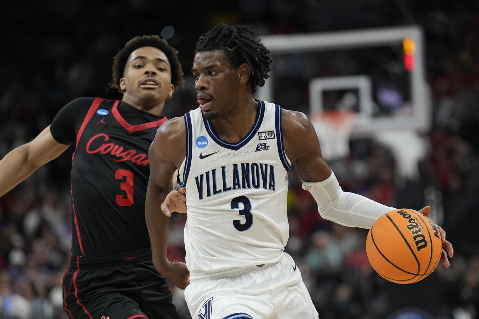 Villanova forward Brandon Slater drives to the basket past Houston guard Ramon Walker Jr. during the first half of a college basketball game in the Elite Eight round of the NCAA tournament on Saturday, March 26, 2022, in San Antonio. (AP Photo/Eric Gay)