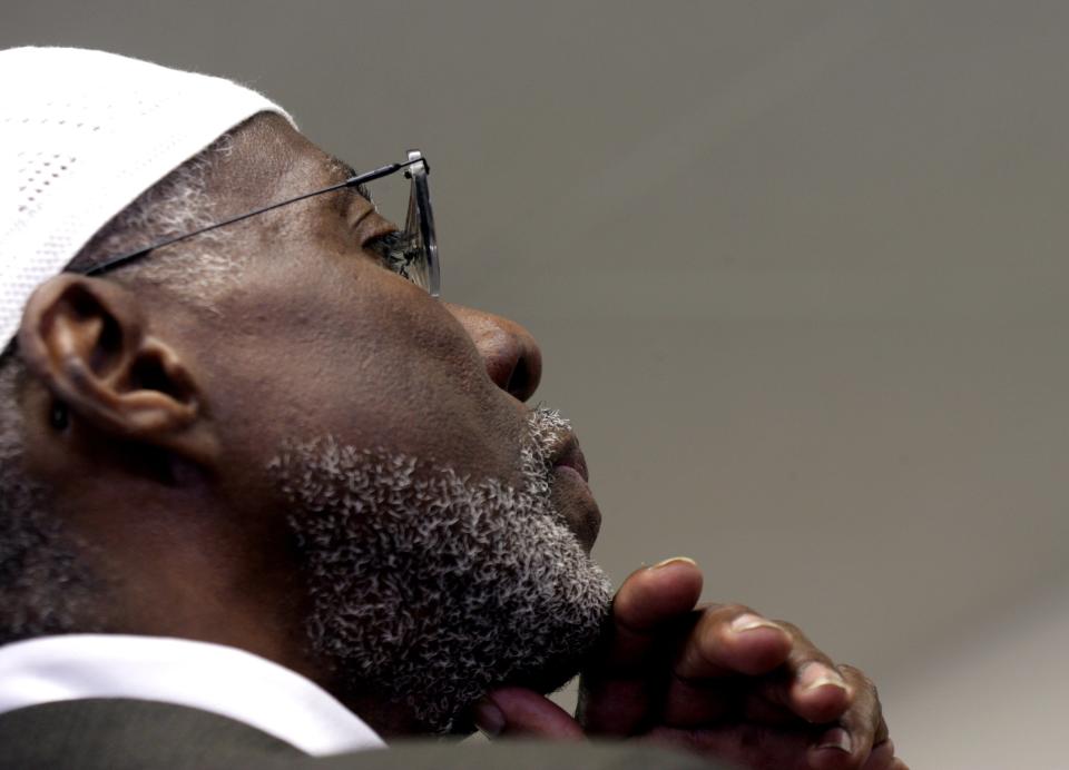 Imam Abdullah El-Amin, listens to Sharona Shapiro, of West Bloomfield, while she explains why each title given to the Muslim Center of Detroit was chosen for donation on Thursday, June 28, 2007.