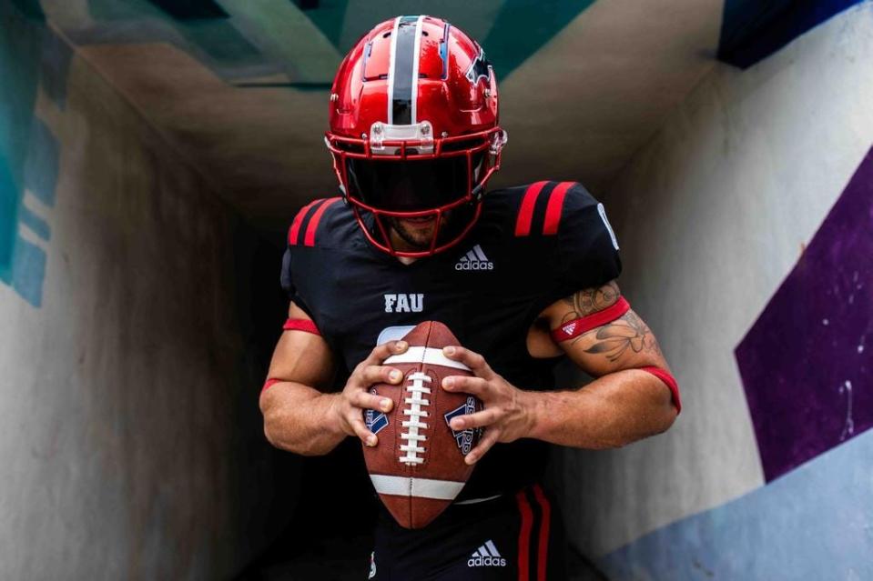 The Owls' alternate uniform is mostly black with red and white trim.