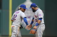 New York Mets shortstop Francisco Lindor (12) and second baseman Luis Guillorme (13) celebrate after the first baseball game of a doubleheader against the Washington Nationals, Saturday, June 19, 2021, in Washington. The Mets won 5-1. (AP Photo/Nick Wass)