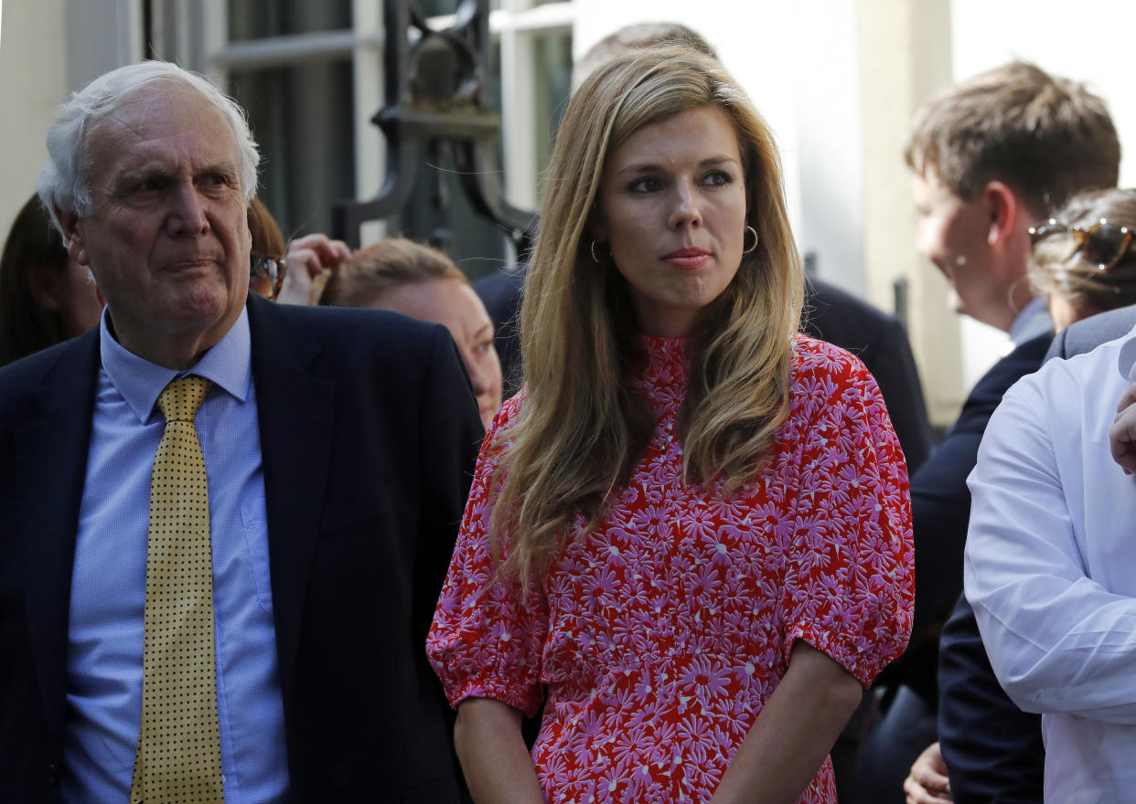 Carrie Symonds the girlfriend of Britain's new Prime Minister Boris Johnson waits in 10 Downing Street, London, Wednesday, July 24, 2019. Boris Johnson has replaced Theresa May as Prime Minister, following her resignation last month after Parliament repeatedly rejected the Brexit withdrawal agreement she struck with the European Union. (AP Photo/Frank Augstein)