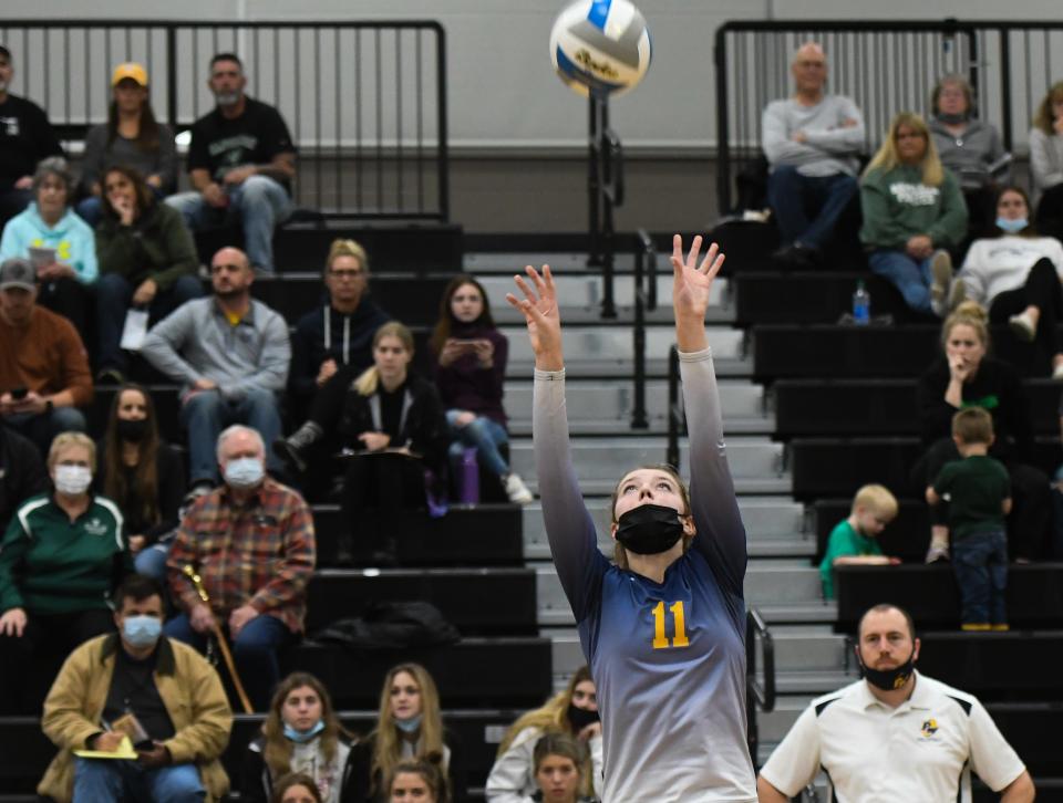 Pewamo-Westphalia's Taylor  Smith sets the ball against Napoleon Thursday, Nov. 11, 2021, during the regional final at Dansville.  P-W won 3-2.