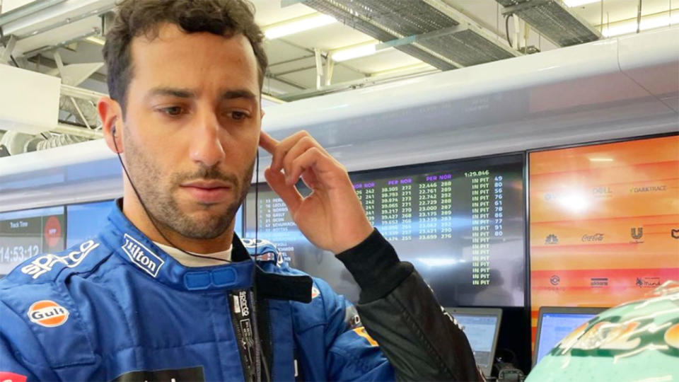 Seen here, Dan Ricciardo talks to his McLaren team through a headset.