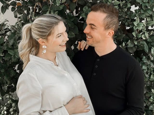 <p>Frankie Muniz Instagram</p> Frankie Muniz poses with his wife, Paige Muniz, in 2021