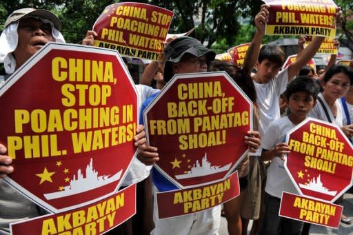 Philippine activists protest outside the Chinese Consular Office in Manila, demanding Beijing withdraw from the Scarborough Shoal