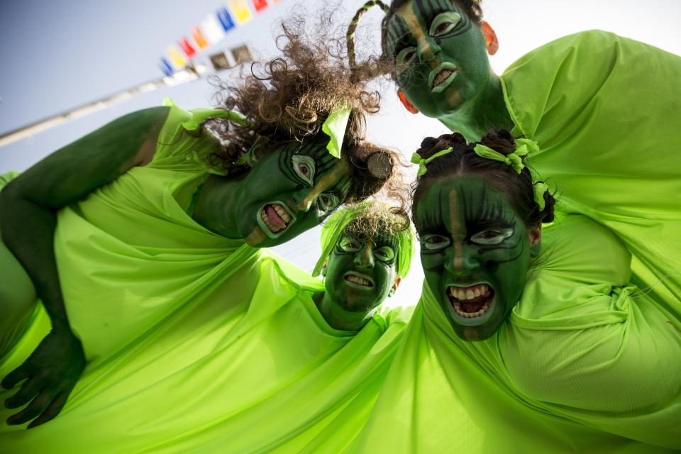 Israeli dancers take part in a parade to celebrate the Jewish holiday of Purim on March 16, 2014 in the central Israeli city of Netanya. The carnival-like Purim holiday is celebrated with parades and costume parties to commemorate the deliverance of the Jewish people from a plot to exterminate them in the ancient Persian empire 2,500 years ago, as recorded in the Biblical Book of Esther. AFP PHOTO / JACK GUEZ        (Photo credit should read JACK GUEZ/AFP/Getty Images)