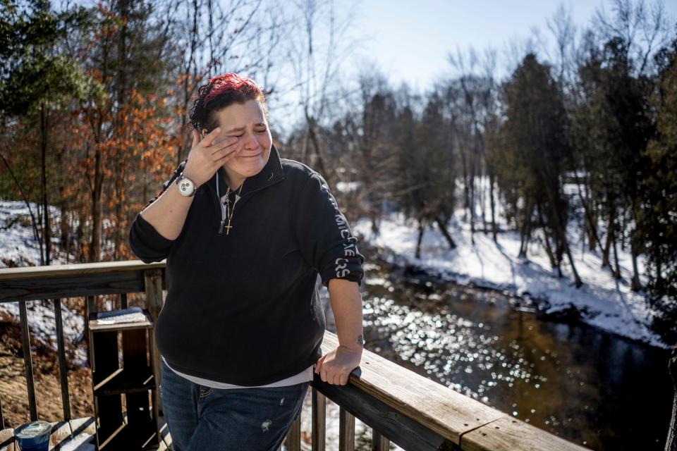 Courtney Cirone, 41, of Marion, stands outside of her home in northern Michigan where she developed a spore-caused fungal disease called blastomycosis and a similar fungal disease, histoplasmosis. "It's just been a nightmare for all of us back here. We're dying and we need help and thousands of people are dying every year and nobody's doing anything about it. So many animals are dying and the veterinarians don't know to look for it. Doctors don't know to look for it," said Cirone, who lost her cat Diesel and dog Bruno. Some people breathe in these spores and are fine; some contract cold or flu-like symptoms and get better in short order. But for some, it can be far more serious, and affect organs, bones and especially lungs.