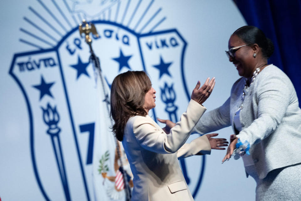 US Vice President Kamala Harris is greeted by the International President of Zeta Phi Beta Sorority, Stacie NC Grant, before delivering the keynote speech at Zeta Phi Beta Sorority, Inc.'s Grand Boulé event at the Indiana Convention Center in Indiana.