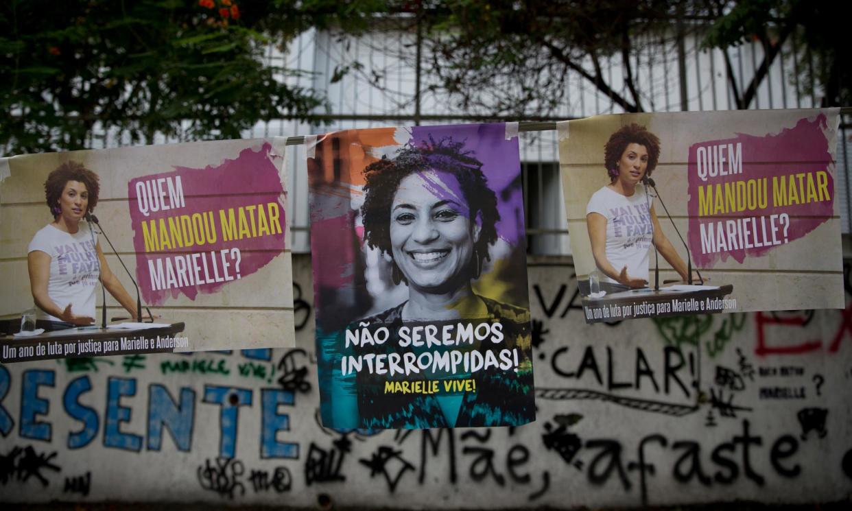 <span>Posters showing councilwoman Marielle Franco, whose murder has inspired a generation of journalists to probe Rio’s underworld and its ties to police and politicians.</span><span>Photograph: Silvia Izquierdo/AP</span>