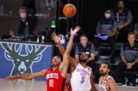 Houston Rockets' Eric Gordon (10) and Oklahoma City Thunder's Chris Paul (3) battle for the tipoff during the fourth quarter of Game 2 of an NBA basketball first-round playoff series, Thursday, Aug. 20, 2020, in Lake Buena Vista, Fla. (Kevin C. Cox/Pool Photo via AP)