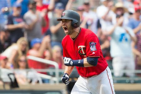Jul 15, 2018; Minneapolis, MN, USA; Minnesota Twins second baseman Brian Dozier (2) celebrates his run in the seventh inning against Tampa Bay Rays at Target Field. Mandatory Credit: Brad Rempel-USA TODAY Sports