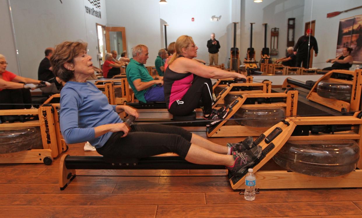 Anne Gass, of Barrington, works out on the WaterRower rowing machine at 426 Fitness, Bristol.